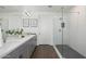 Modern bathroom features dual sinks, quartz countertops, and a glass-enclosed shower at 5100 E Rancho Paloma Dr # 1044, Cave Creek, AZ 85331
