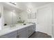 Clean bathroom with double sink, long vanity and a walk-in glass shower at 5100 E Rancho Paloma Dr # 1044, Cave Creek, AZ 85331