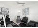 Bright office space with black desks, a gray recliner, and art, creating an inspiring workspace at 5100 E Rancho Paloma Dr # 1044, Cave Creek, AZ 85331
