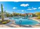 Inviting pool area complete with clear blue water, lounge chairs, umbrellas, and views of the desert landscape at 5100 E Rancho Paloma Dr # 1044, Cave Creek, AZ 85331