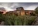 Building exteriors of available restaurants and dentists with beautiful desert landscaping at 5100 E Rancho Paloma Dr # 1044, Cave Creek, AZ 85331