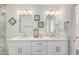 Bright bathroom featuring double sinks, granite counters, and modern decor at 5211 E Winchcomb Dr, Scottsdale, AZ 85254