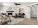 Inviting living room with patterned tile fireplace, art, and comfortable seating on wood-look flooring at 5211 E Winchcomb Dr, Scottsdale, AZ 85254