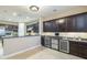 Gourmet kitchen with a butler's bar with dual wine coolers and additional cabinets at 5243 E Windstone Trl, Cave Creek, AZ 85331