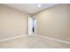 Bedroom with soft carpeting and neutral colored walls adjacent to an open doorway and minimalist decor at 5243 E Windstone Trl, Cave Creek, AZ 85331