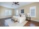 Comfortable bedroom with wood floors, neutral decor, bench, and lots of natural light at 5243 E Windstone Trl, Cave Creek, AZ 85331