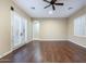 Bedroom features wood floors, bright natural light, neutral colored walls, and a ceiling fan at 5243 E Windstone Trl, Cave Creek, AZ 85331