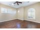 Bedroom features wood floors, bright natural light and neutral colored walls at 5243 E Windstone Trl, Cave Creek, AZ 85331