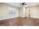 Bedroom features wood floors, bright natural light and neutral colored walls at 5243 E Windstone Trl, Cave Creek, AZ 85331