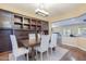 Charming dining area features hardwood floors, stylish chandelier, and custom built-in storage at 5243 E Windstone Trl, Cave Creek, AZ 85331