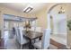 The light-filled dining area offers a rustic table, white seating, and elegant chandelier at 5243 E Windstone Trl, Cave Creek, AZ 85331