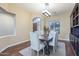 This dining room features a rustic wood table, neutral chairs, and a decorative chandelier at 5243 E Windstone Trl, Cave Creek, AZ 85331