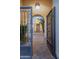 Inviting gated courtyard featuring brick pavers, and lush greenery, leading to the home's entrance at 5243 E Windstone Trl, Cave Creek, AZ 85331