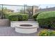 Paver patio features an outdoor fire pit with seating and lush landscaping in a fenced yard at 5243 E Windstone Trl, Cave Creek, AZ 85331