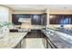Detailed view of a gourmet kitchen with stainless steel appliances and granite countertops at 5243 E Windstone Trl, Cave Creek, AZ 85331