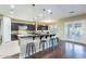 Gourmet kitchen boasts stainless steel appliances, granite countertops, and a breakfast bar with seating at 5243 E Windstone Trl, Cave Creek, AZ 85331