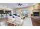 Open concept living area with stone fireplace, hardwood floors and shutters at 5243 E Windstone Trl, Cave Creek, AZ 85331
