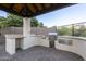 Outdoor kitchen features stainless steel grill and ample counter space at 5243 E Windstone Trl, Cave Creek, AZ 85331