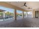 Covered patio overlooking a tranquil pool, a rock waterfall, and manicured landscaping perfect for outdoor living at 5243 E Windstone Trl, Cave Creek, AZ 85331