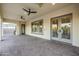 Spacious covered patio with brick flooring, ceiling fans, and access to backyard at 5243 E Windstone Trl, Cave Creek, AZ 85331