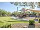 Community playground with shade structure, swings, and climbing features at 5243 E Windstone Trl, Cave Creek, AZ 85331