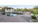 Outdoor pool area features a gazebo, built-in grill, and rock waterfall feature at 5243 E Windstone Trl, Cave Creek, AZ 85331