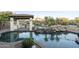 Outdoor pool area features a gazebo, built-in grill, and rock waterfall feature at 5243 E Windstone Trl, Cave Creek, AZ 85331