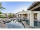 Pool area with covered patio, professional landscaping, and scenic backyard at 5243 E Windstone Trl, Cave Creek, AZ 85331