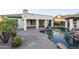 Pool area with covered patio, professional landscaping, and scenic backyard at 5243 E Windstone Trl, Cave Creek, AZ 85331