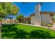 Picturesque backyard featuring a pergola, green lawn, and covered patio at 5312 S Hazelton Ln, Tempe, AZ 85283