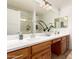 Bathroom offers double sinks, a large mirror, wood cabinets, and a walk in shower at 5312 S Hazelton Ln, Tempe, AZ 85283