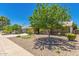 Charming single-story home with desert landscaping and a large shade tree at 5312 S Hazelton Ln, Tempe, AZ 85283