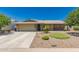 Charming single-story home featuring low maintenance desert landscaping and attached two-car garage at 5312 S Hazelton Ln, Tempe, AZ 85283