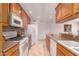 Bright kitchen featuring wood cabinets, tile backsplash, and granite countertops at 5312 S Hazelton Ln, Tempe, AZ 85283