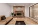 Spacious living room with a brick fireplace, tan sofa, and glass sliding doors at 5312 S Hazelton Ln, Tempe, AZ 85283