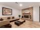 Comfortable living room featuring brick fireplace and neutral tile flooring at 5312 S Hazelton Ln, Tempe, AZ 85283
