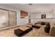 Open concept living room with neutral walls and tile, sliding glass doors, and breakfast bar at 5312 S Hazelton Ln, Tempe, AZ 85283