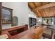 Rustic bar featuring tile countertops, a wine rack, and a view into the living area at 5540 E Mercer Ln, Scottsdale, AZ 85254