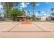 Recreational basketball court surrounded by mature landscaping and trees at 5540 E Mercer Ln, Scottsdale, AZ 85254