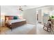 Relaxing bedroom featuring a textured rug, a ceiling fan, and natural light at 5540 E Mercer Ln, Scottsdale, AZ 85254