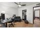 The bedroom includes space for an office, comfortable seating, and closet organizer at 5540 E Mercer Ln, Scottsdale, AZ 85254