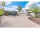 Spacious driveway leads to a two-car garage and covered parking at 5540 E Mercer Ln, Scottsdale, AZ 85254