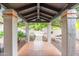Inviting entryway with brick flooring, overhead lighting, and a view of the landscaped path and fountain at 5540 E Mercer Ln, Scottsdale, AZ 85254