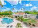 Aerial view of the home's exterior, showcasing the backyard pool, lush landscaping, and well-maintained surroundings at 5540 E Mercer Ln, Scottsdale, AZ 85254
