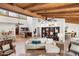Spacious living room featuring high ceilings, exposed wood beams, and an open floor plan at 5540 E Mercer Ln, Scottsdale, AZ 85254