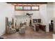 Open living room area with high ceilings, a built-in bar, and a comfortable seating area at 5540 E Mercer Ln, Scottsdale, AZ 85254