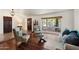 Comfortable living room with large window, neutral colors, and hardwood floors creates a cozy space at 5540 E Mercer Ln, Scottsdale, AZ 85254
