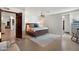 This spacious main bedroom has great light, ceiling fan and access to the main bathroom at 5540 E Mercer Ln, Scottsdale, AZ 85254