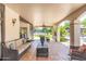 Expansive covered patio offering a comfortable outdoor living space with tile flooring at 5540 E Mercer Ln, Scottsdale, AZ 85254