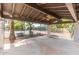 Covered patio with a view of the community tennis court and desert landscaping at 5540 E Mercer Ln, Scottsdale, AZ 85254